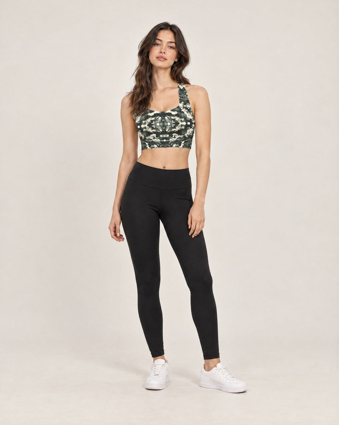 Vazzari Verdant Shadows Longline Sports Bra on a female model in a clean white studio (woman)