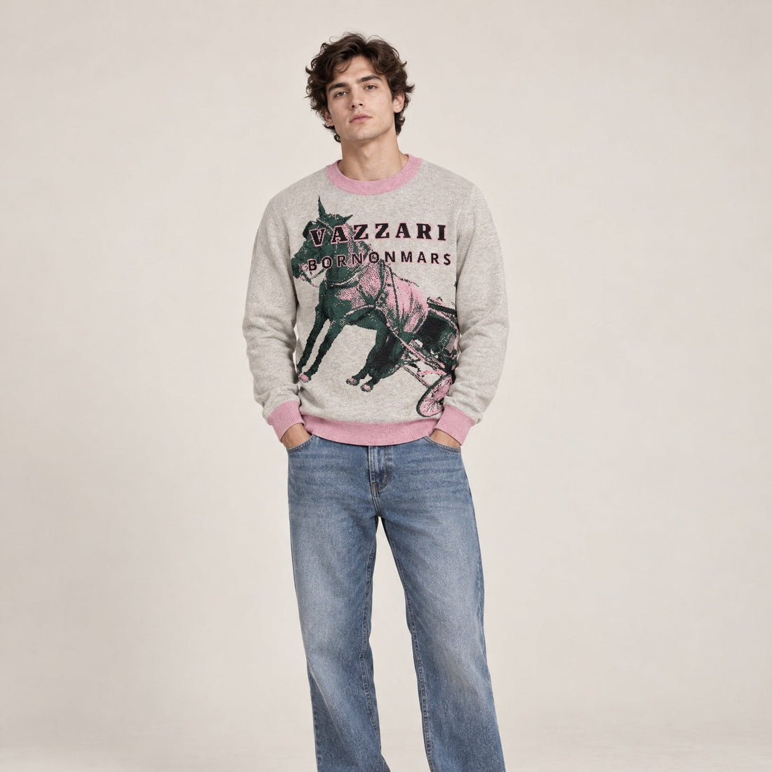 Model in the grey Vazzari Born On Mars Knit – Horse with pink trims and green horse embroidery, worn with light-wash jeans