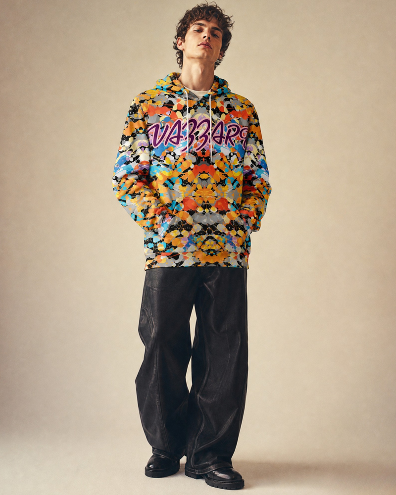 Vazzari Amor Vitae Fleece Hoodie (ELLeMENTAL) on a male model in a clean beige studio (man)