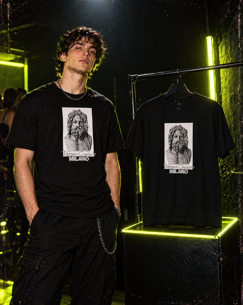 Model wearing Vazzari VZI Men's Fitted tee in a neon club setting