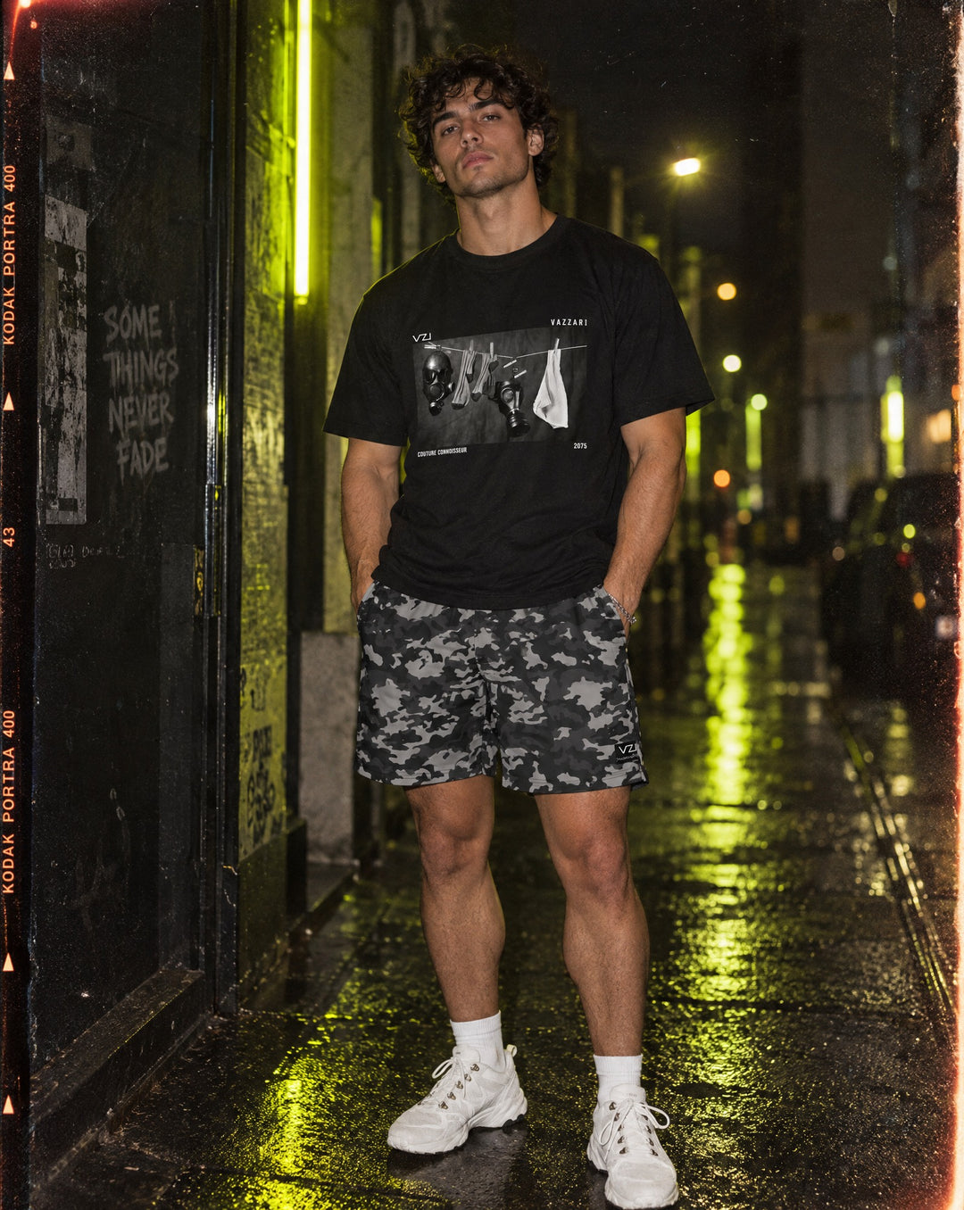 Model wearing Vazzari lightweight shorts in a neon night setting