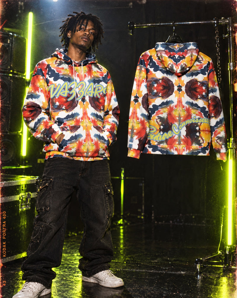 Model wearing Vazzari ELLeMENTAL collection piece in a neon club setting