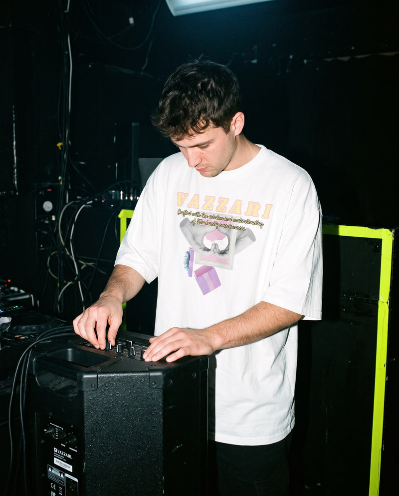 Model wearing Vazzari Pure Code essentials in a neon club setting