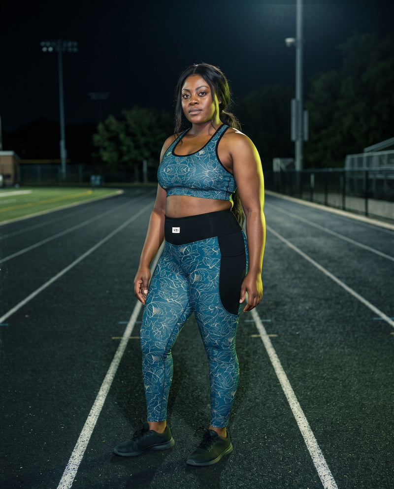 Model wearing Vazzari SuperSport leggings with pockets in a gym training setting