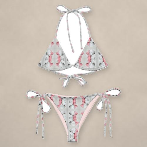 Vazzari Alabaster Grace String Bikini on beige studio wall