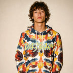 Model wearing the Vazzari Amor Vitae Fleece Hoodie in a beige studio