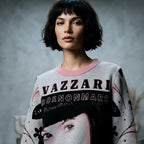 Model wearing the Vazzari Born On Mars Knit – Brunette in a beige studio