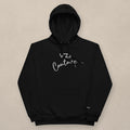 Vazzari Couture Eco Hoodie on beige studio wall