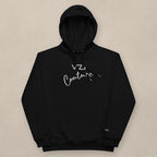 Vazzari Couture Eco Hoodie on beige studio wall