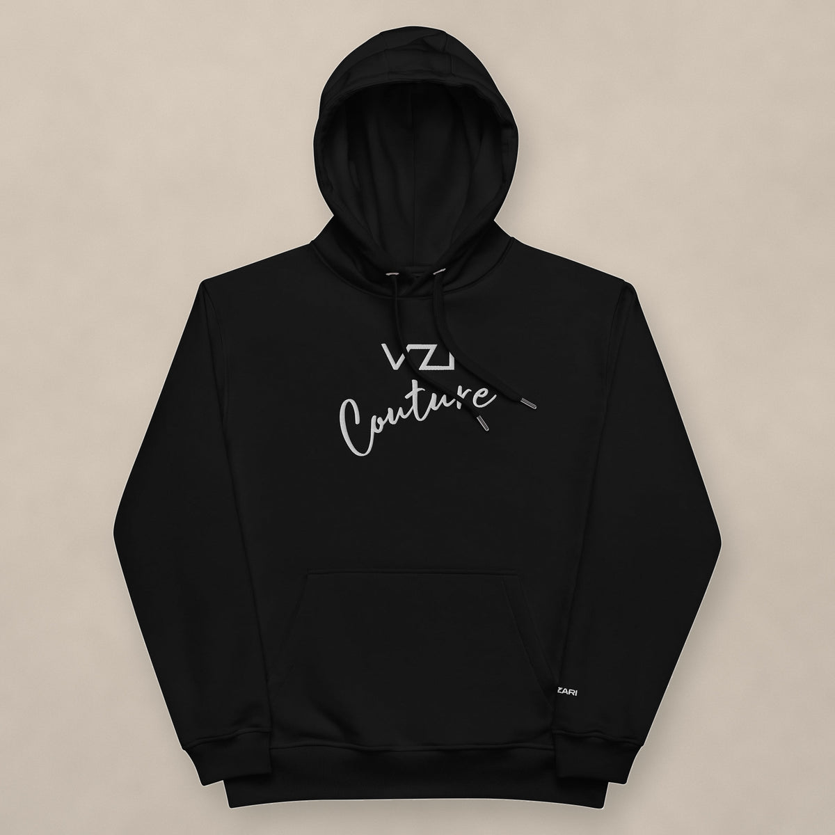 Vazzari Couture Eco Hoodie on beige studio wall