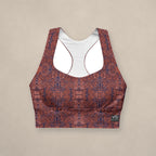 Vazzari Crimson Deities Longline Bra on beige studio wall