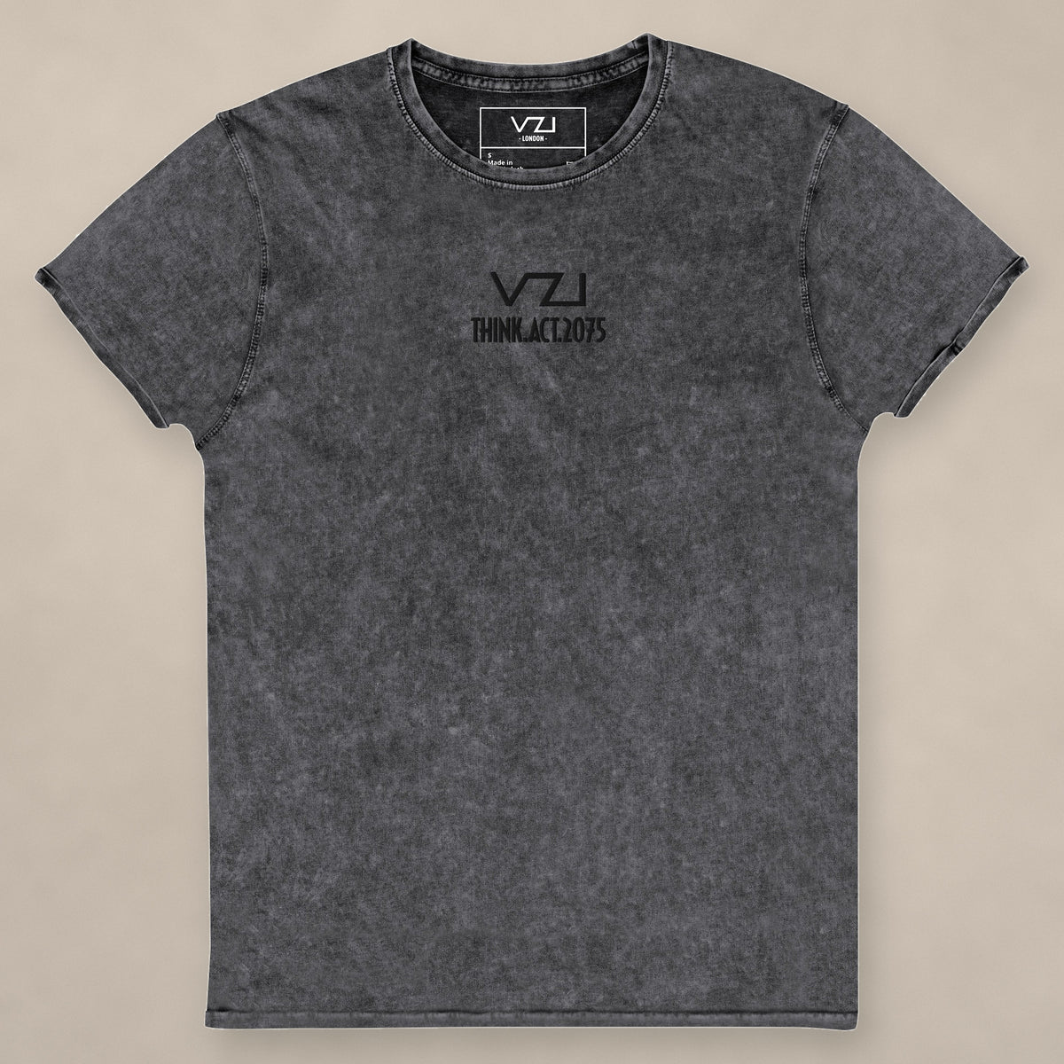 Vazzari Denim Club Tee II on beige studio wall