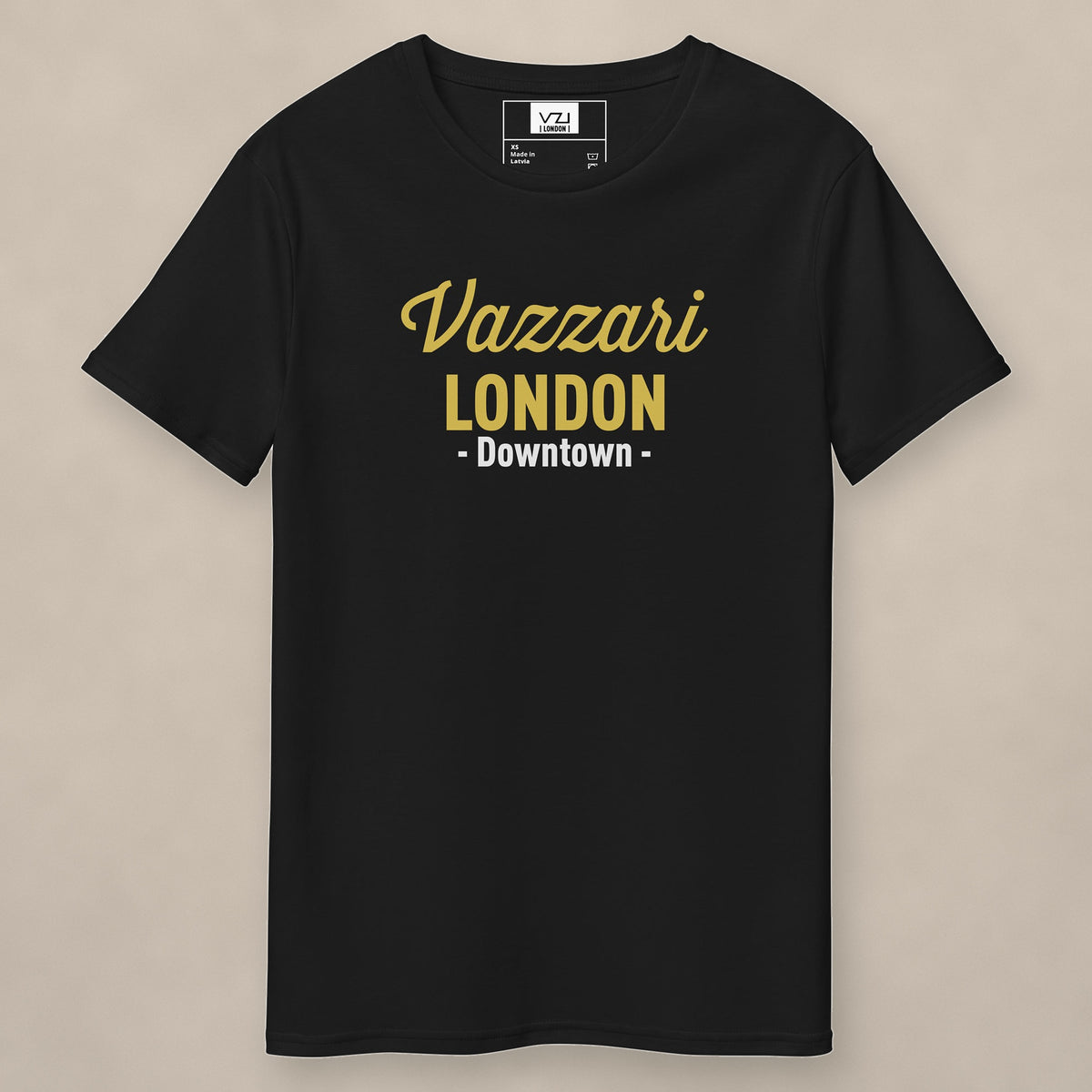 Vazzari Downtown London Tee – Old Gold on beige studio wall