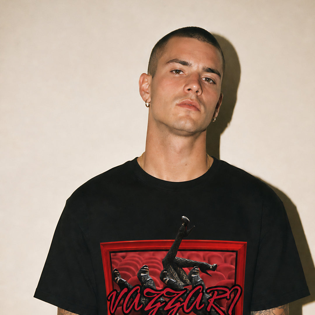 Model wearing the Vazzari Irresistible Allure Tee in a beige studio
