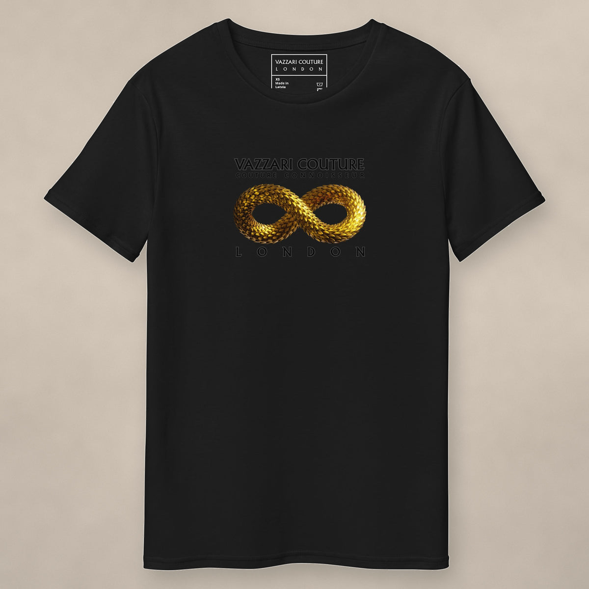 Vazzari Limitless Gold Tee on beige studio wall