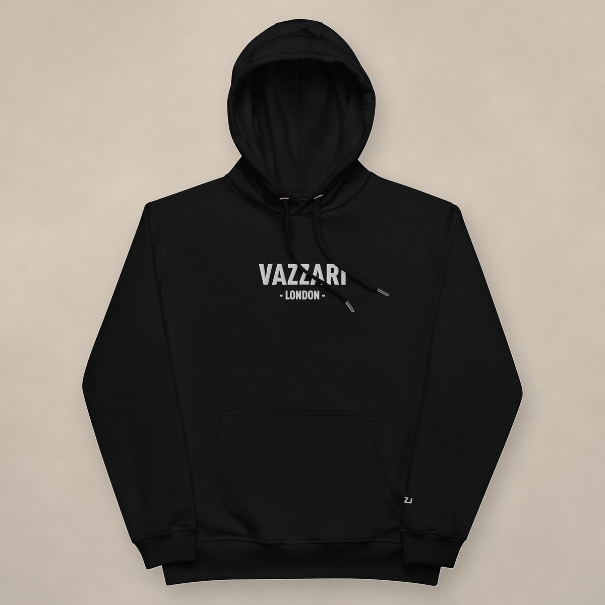 Vazzari London Unisex Hoodie on beige studio wall