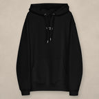 Vazzari Organic Essential Hoodie on beige studio wall
