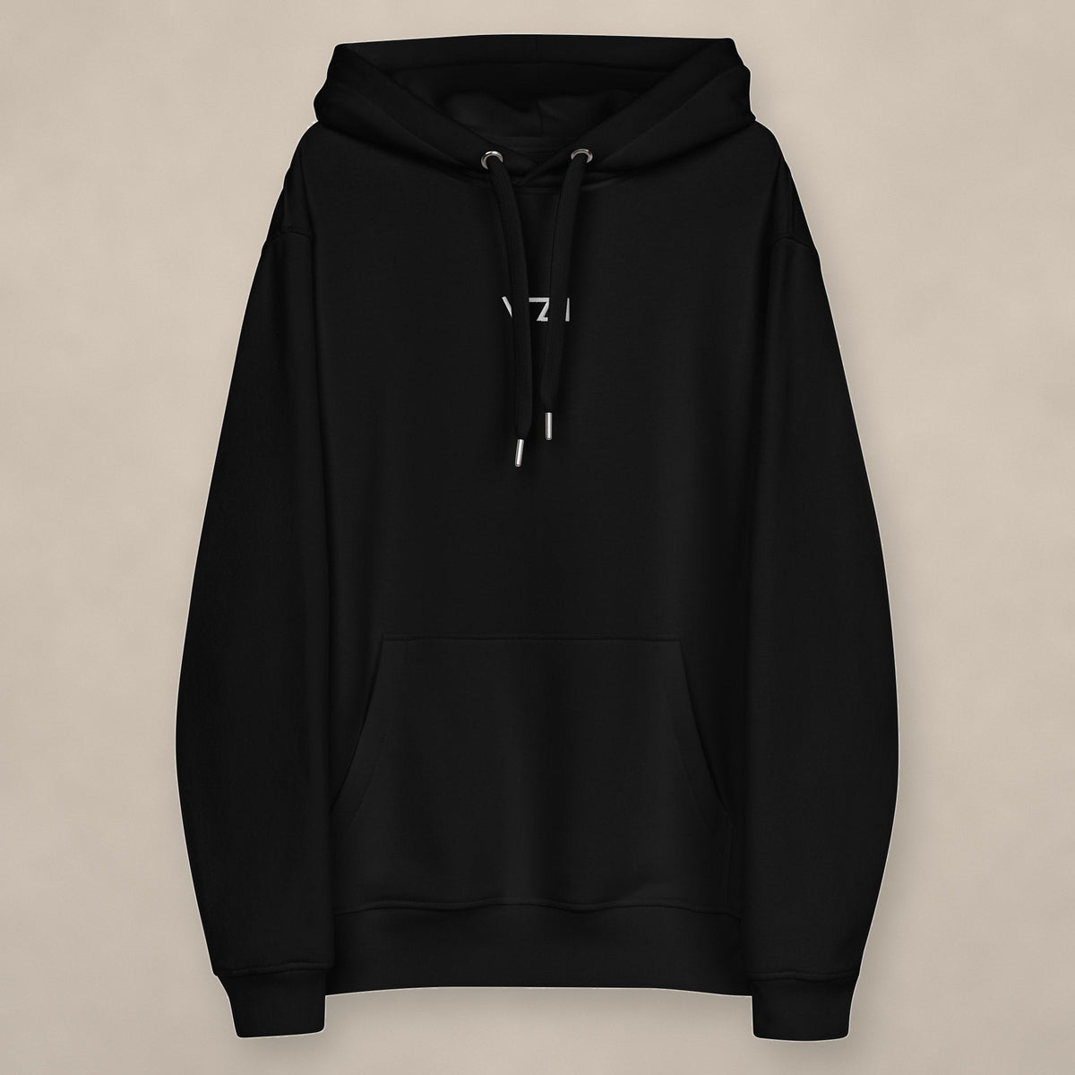 Vazzari Organic Essential Hoodie on beige studio wall