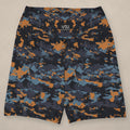 Vazzari Teal Twilight Yoga Shorts on beige studio wall