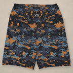Vazzari Teal Twilight Yoga Shorts on beige studio wall