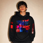 Model wearing the Vazzari Transmutation Matrix Hoodie in a beige studio