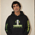 Model wearing the Vazzari UHNWI Hoodie in a beige studio