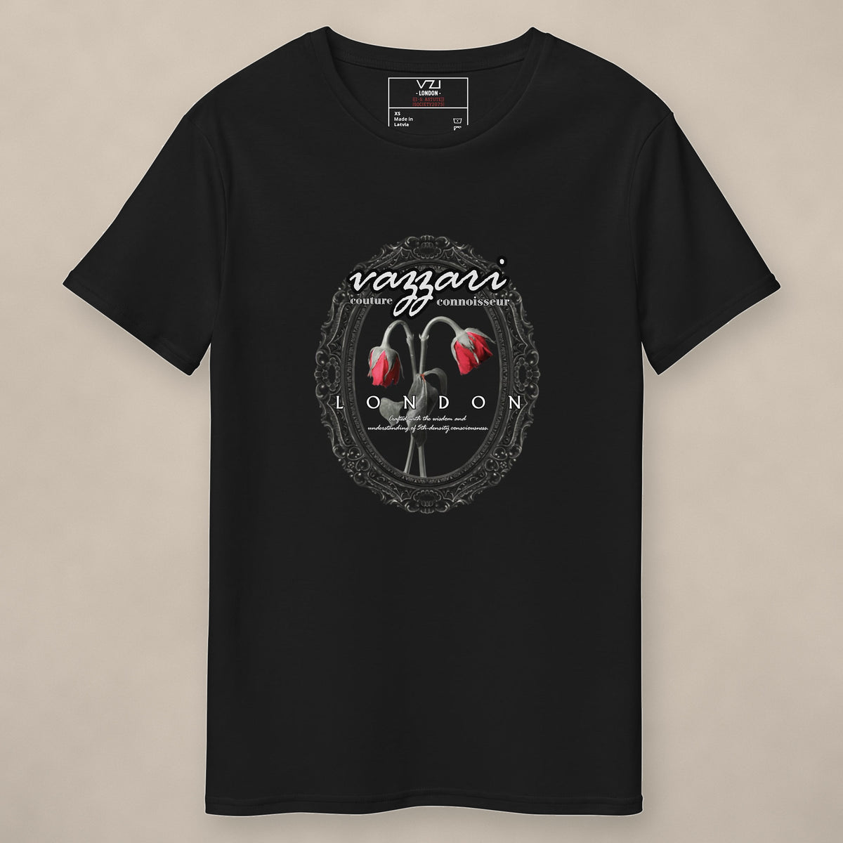 Vazzari Veiled Secrets Tee on beige studio wall