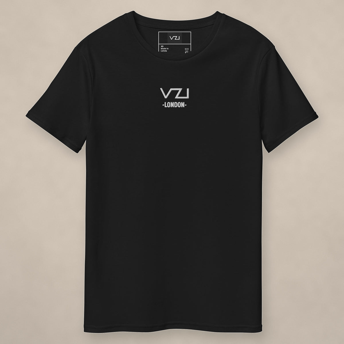 Vazzari VZI London Cotton Tee on beige studio wall