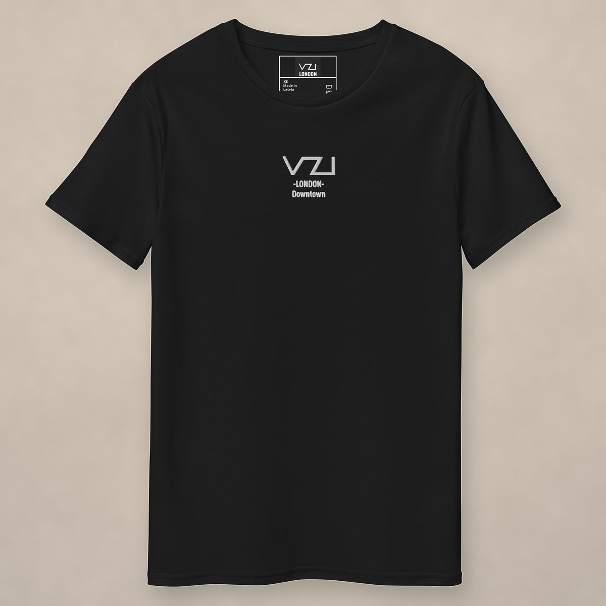 Vazzari VZI London Downtown Tee on beige studio wall