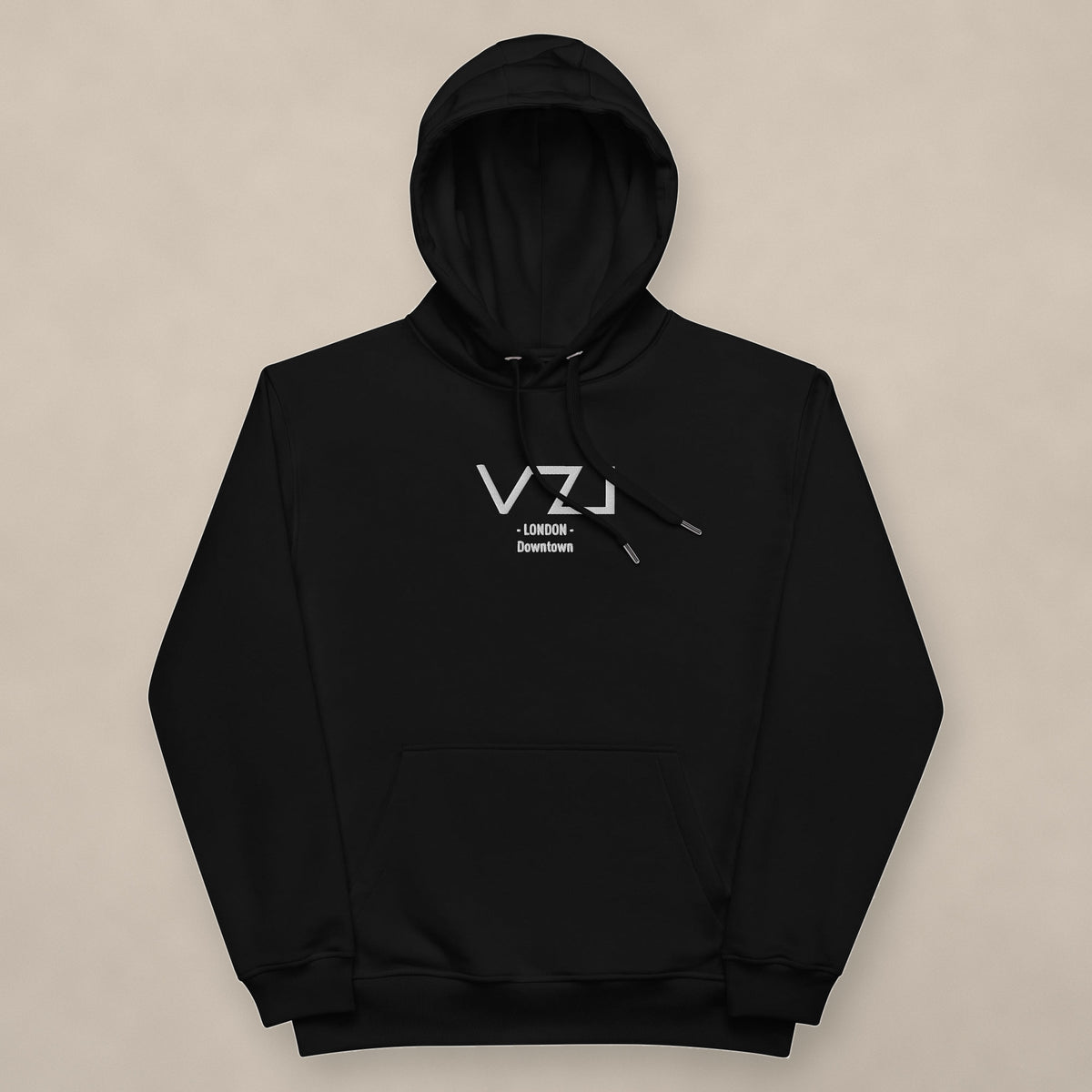 Vazzari VZI London Organic Hoodie on beige studio wall