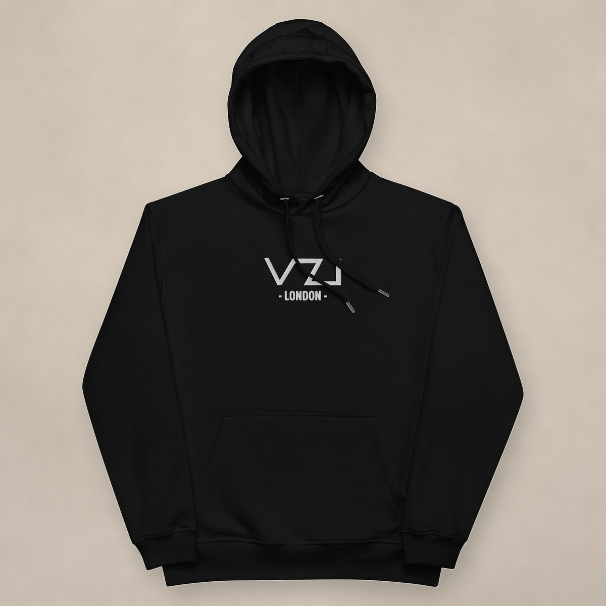 Vazzari VZI London Unisex Hoodie on beige studio wall
