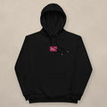 Vazzari Women's Eco Hoodie – Flamingo on beige studio wall